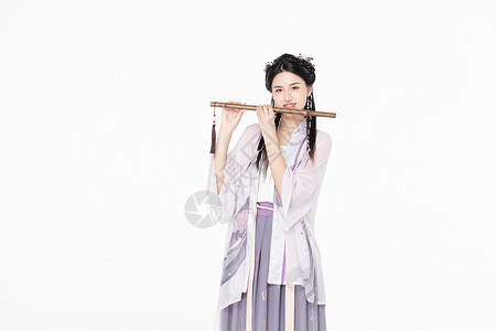 中国风汉服美女吹竹笛背景图片
