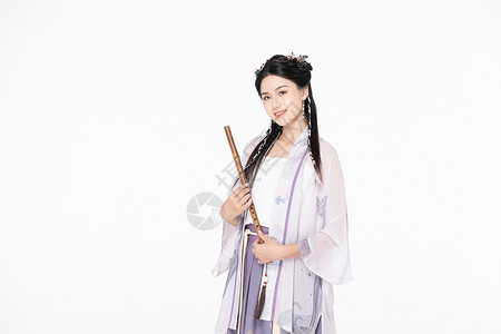 中国风汉服美女吹竹笛图片