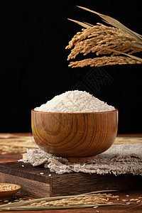 木碗里的粮食大米背景图片