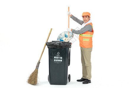 使用簸箕倒垃圾的环卫工人图片