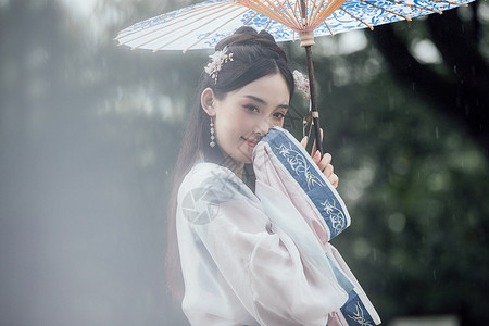 Q版人物元素中国风古风汉服美女雨中撑伞背景