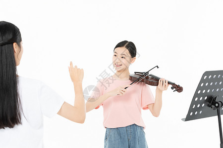 指挥的女孩老师指挥青少年学生拉小提琴背景