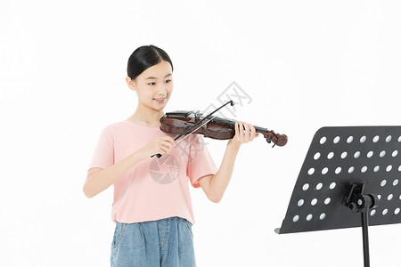 青少年学生学习拉小提琴背景图片