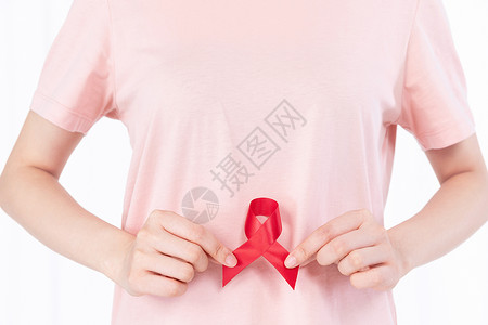粉色卡通预防世界艾滋病插画红丝带关爱艾滋病患者背景