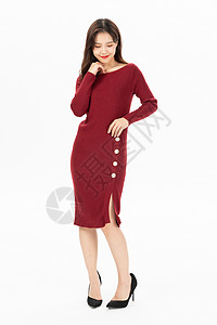 穿红色针织连衣裙的时尚女性高清图片