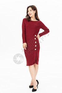 穿红色针织连衣裙的时尚女性图片