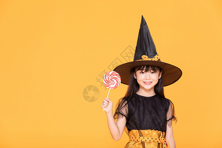 巫女帽万圣节小女孩cos巫女拿棒棒糖背景