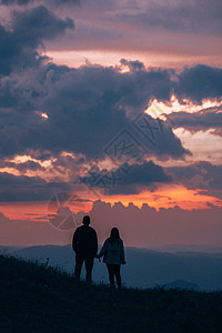 夕阳情侣人像剪影摄影图片背景图片