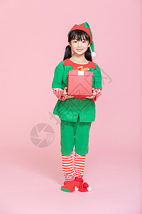 可爱恐龙咪可爱小女孩cos装扮过圣诞节拿礼物盒背景