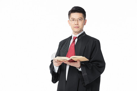 男性律师拿着法律法典青年男性律师翻阅法典背景