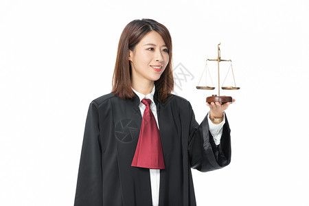 青年女性律师拿天秤背景图片