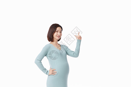 孕期保健孕妇形象怀孕的人手向上指背景