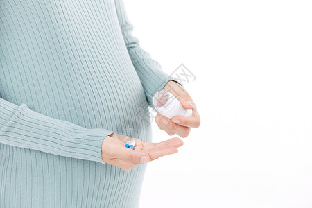 孕期保健吃药的孕妇近景背景