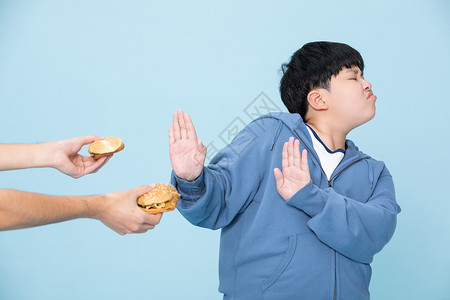 伸手小男孩拒绝吃汉堡的男孩减肥的小孩伸手背景