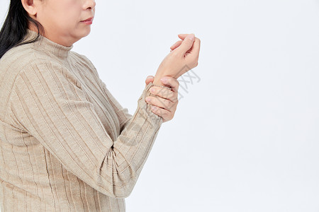 手指关节手部酸痛的中年女性背景