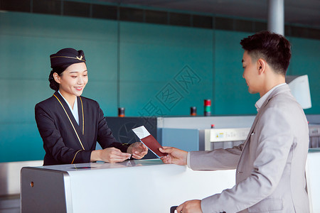 在此注册空姐与乘客在服务台交流背景