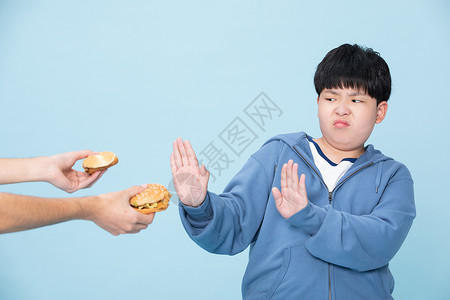 亚洲快餐拒绝吃汉堡的男孩背景