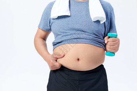 中年肥胖男性举哑铃运动减肥特写图片