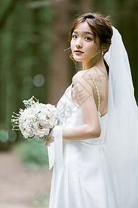 拿手捧花的婚纱美女写真拿手捧花的幸福新娘背景