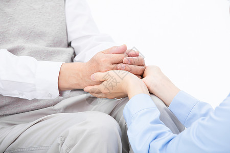 双人对话护士捧着老人的手背景