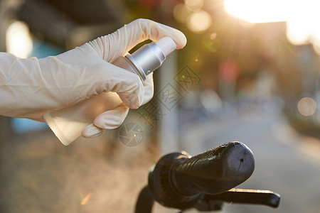 消毒物品自行车喷洒酒精消毒防护特写背景