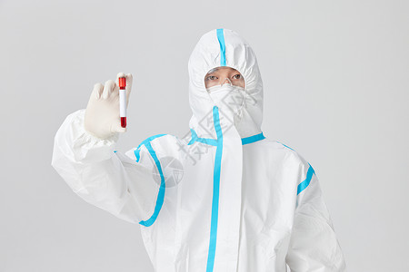 疫情疫苗穿防护服的医护人员手拿试管背景