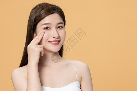 韩式皮肤管理美女按摩自己的眼角背景