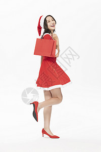 圣诞美女购物拎购物袋背景图片