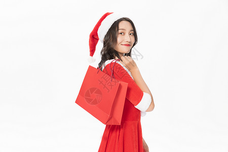 圣诞美女购物拎购物袋背景图片