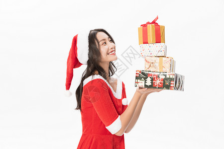 圣诞装扮美女收圣诞礼物盒背景图片