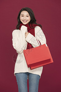 春节手提袋冬季甜美女性过新年拎购物袋背景