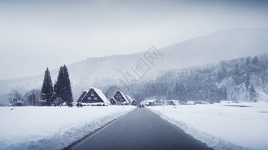 雪闪着白日本冬季白川乡合掌村背景