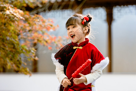 古风汉服中国风小女孩拿糖葫芦中国风儿童新年拿糖葫芦逛公园背景