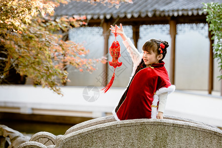 古风新春素材中国风唐装可爱小女孩新年公园游玩背景
