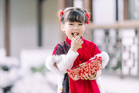 春节古装女孩汉服中国风可爱儿童过新年吃糖果背景