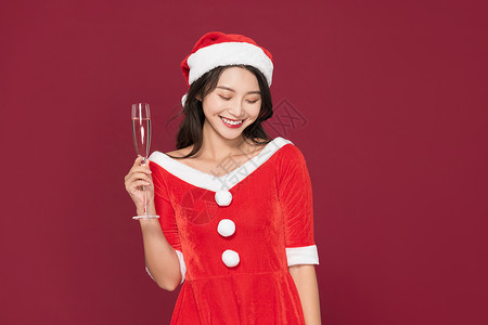 甜美清纯圣诞装扮美女喝香槟背景图片