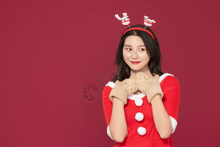 甜美女性戴手套过圣诞背景图片