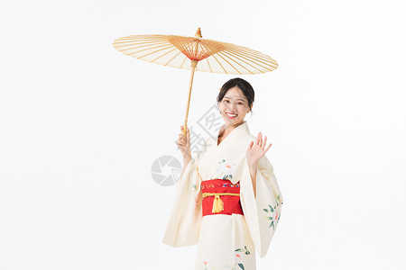 和服美女手撑油纸伞背景图片