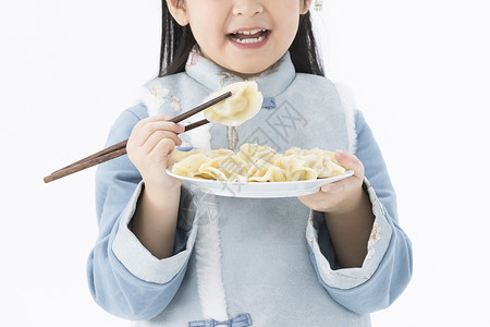 吃饺子的小女孩特写背景图片