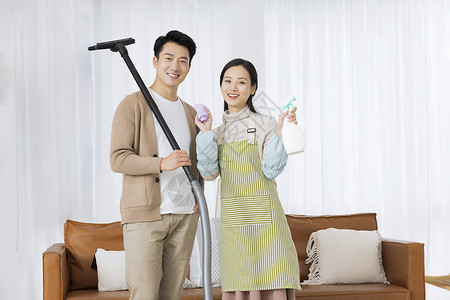 假期大扫除的青年夫妻背景图片