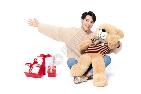 抱着玩具熊的男生阳光韩系男生抱着毛绒玩具熊背景