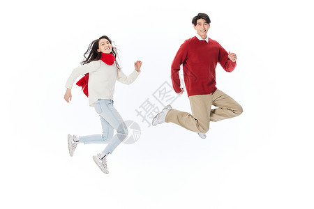 青年夫妻喜庆跳跃迎新年图片