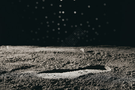 宇航员脚印太空登月微距脚印背景