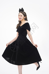 时尚女性黑色礼服写真背景图片