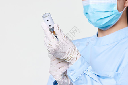 预防新冠病毒护士准备注射疫苗手部特写背景