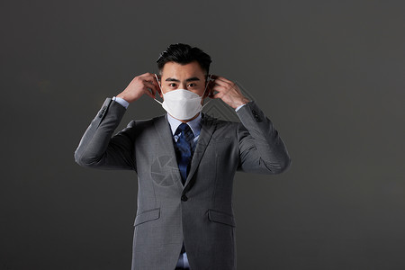 深色商务工作证正在戴口罩的商务男性背景