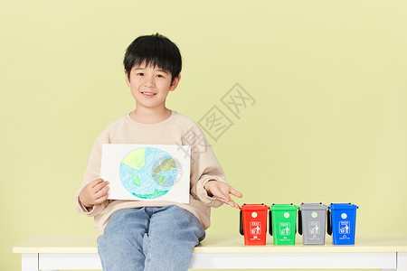 人分类素材展示分类垃圾桶的小男孩背景