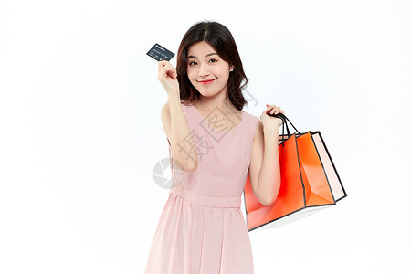 促销手持单页手持信用卡消费的购物女性背景