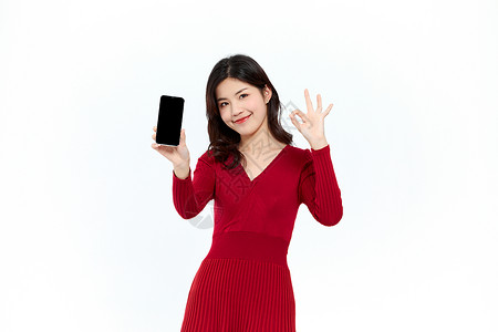 年货手机时尚购物女性展示手机ok手势背景