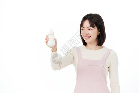 婴儿母乳喂养拿着奶瓶的月嫂形象背景